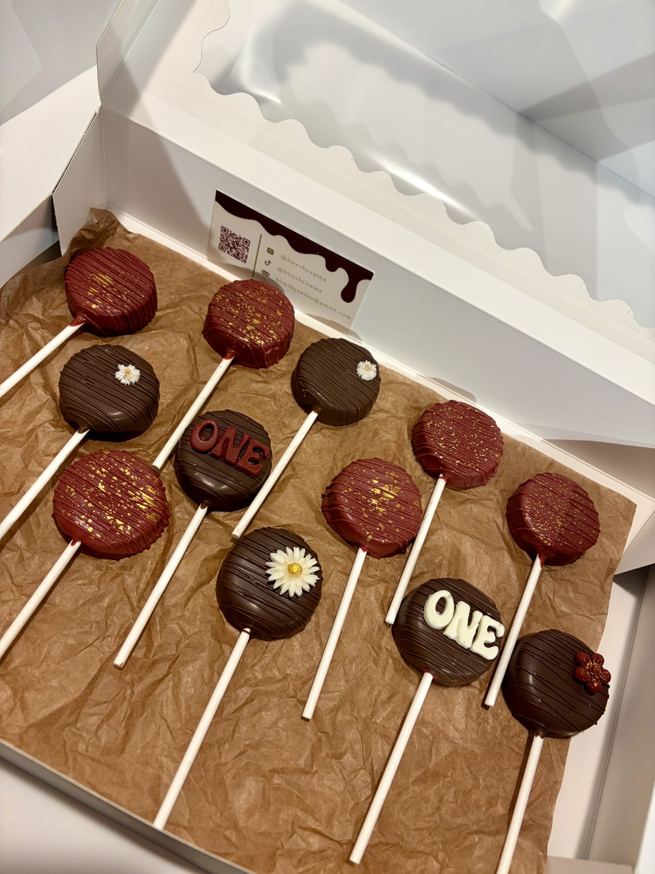 Chocolate cake pops decorated for a first birthday
