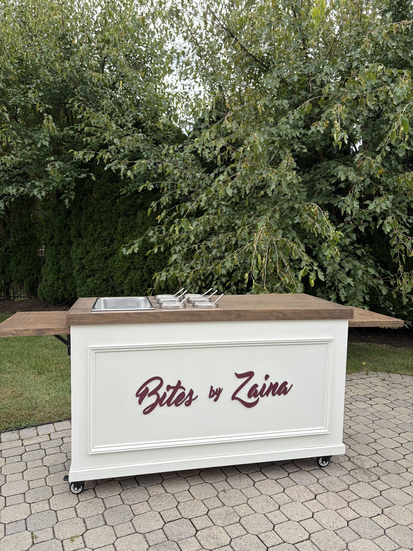 The Bites by Zaina dessert cart set up at an event