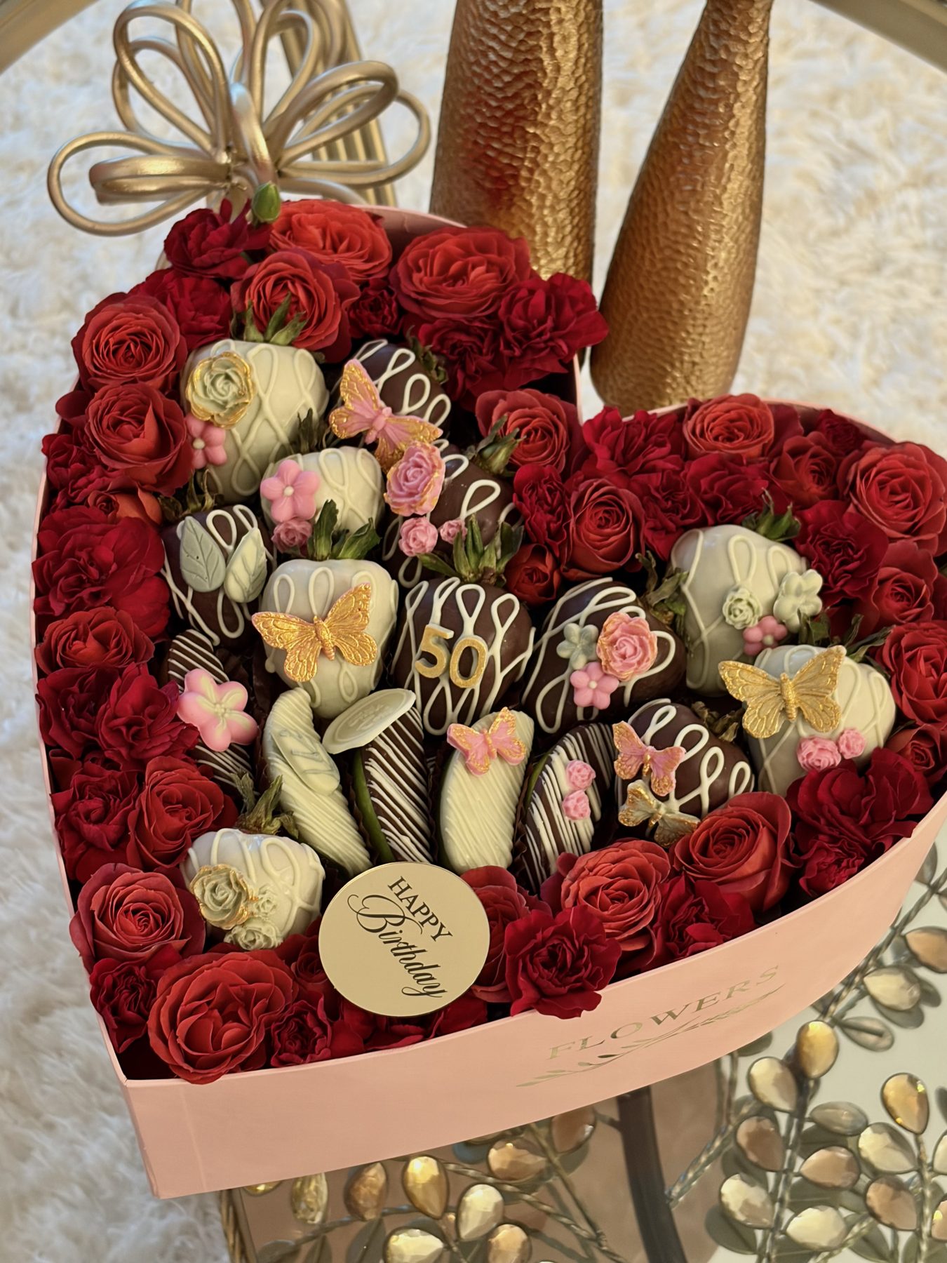 Heart-shaped box of chocolate strawberries and roses
